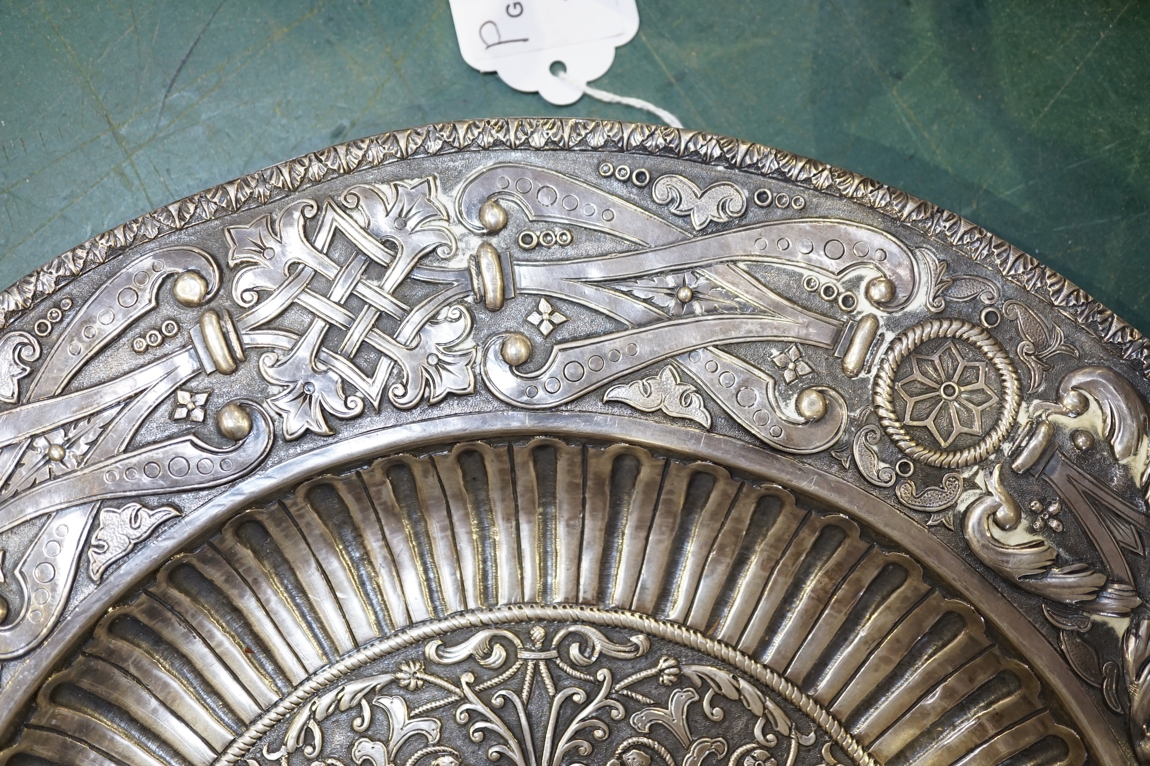 A 20th century Portuguese/Spanish embossed silver charger